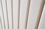 Detailed view of Allure Velvet Bed Beige headboard with vertical tufting and soft velvet texture.