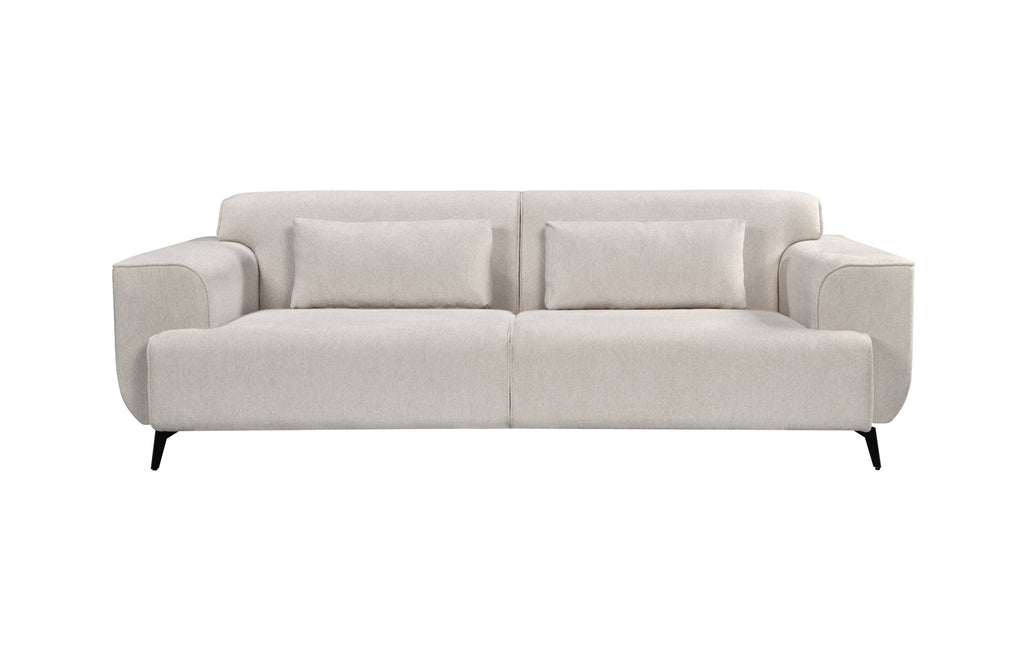 Front view of a light beige 3-seater fixed sofa featuring soft fabric upholstery, black tapered metal legs, and two elongated matching cushions.