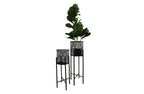 Black beehive planters in two sizes with lush green plants, photographed on a pure white background for a clean, modern look.
