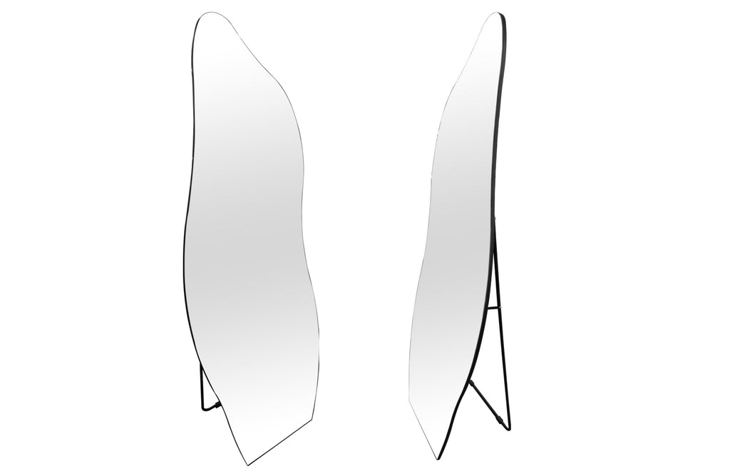 Irregular free standing mirror with sleek frameless design, unique shape and slim metal stand.