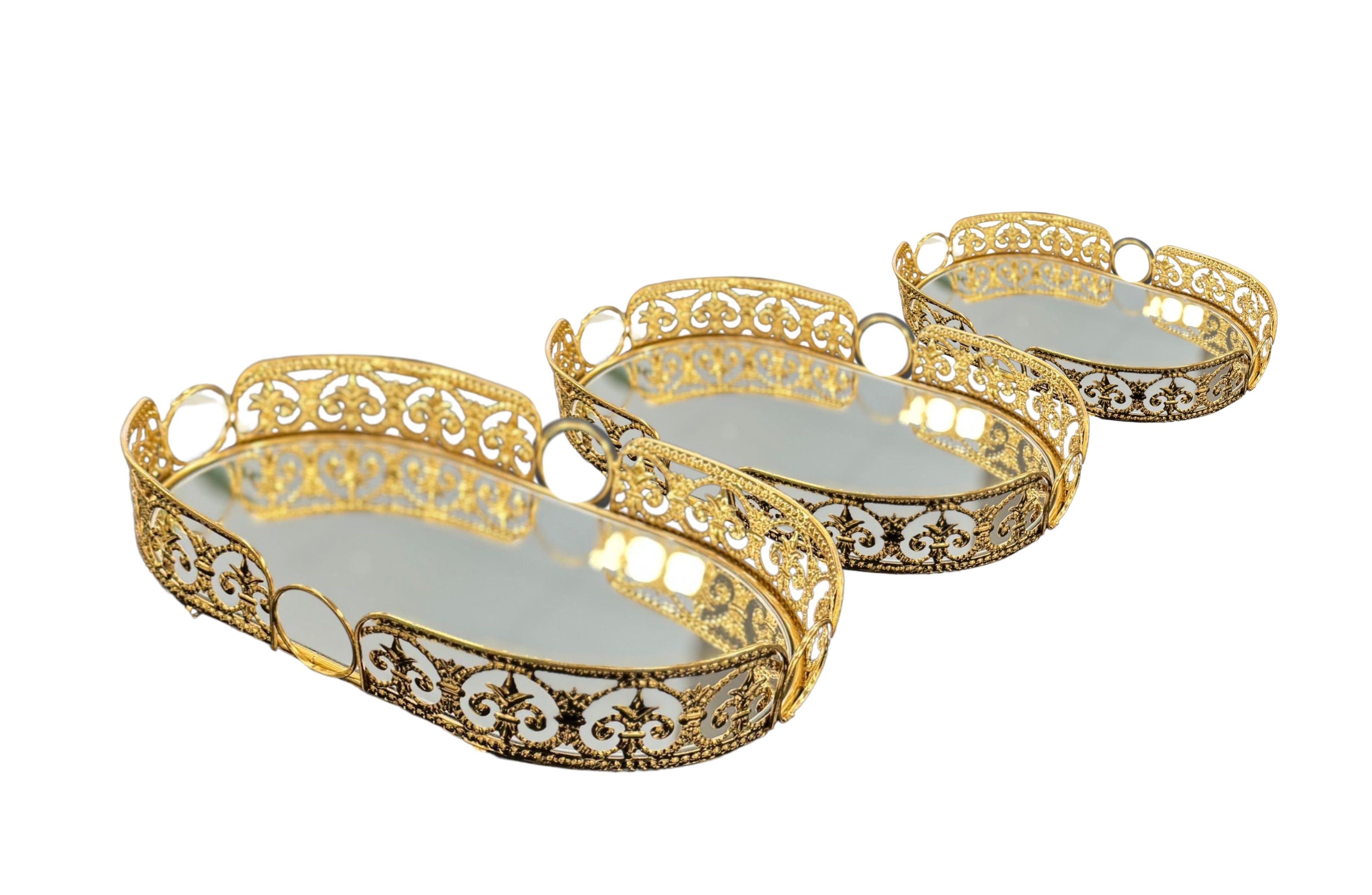 Set of 3 gold oval Lucy trays with elegant filigree edges and mirrored bases – a luxe serving or décor display trio.
