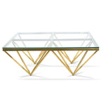 Luxurious pyramid coffee table with gold polished steel frame and clear glass top