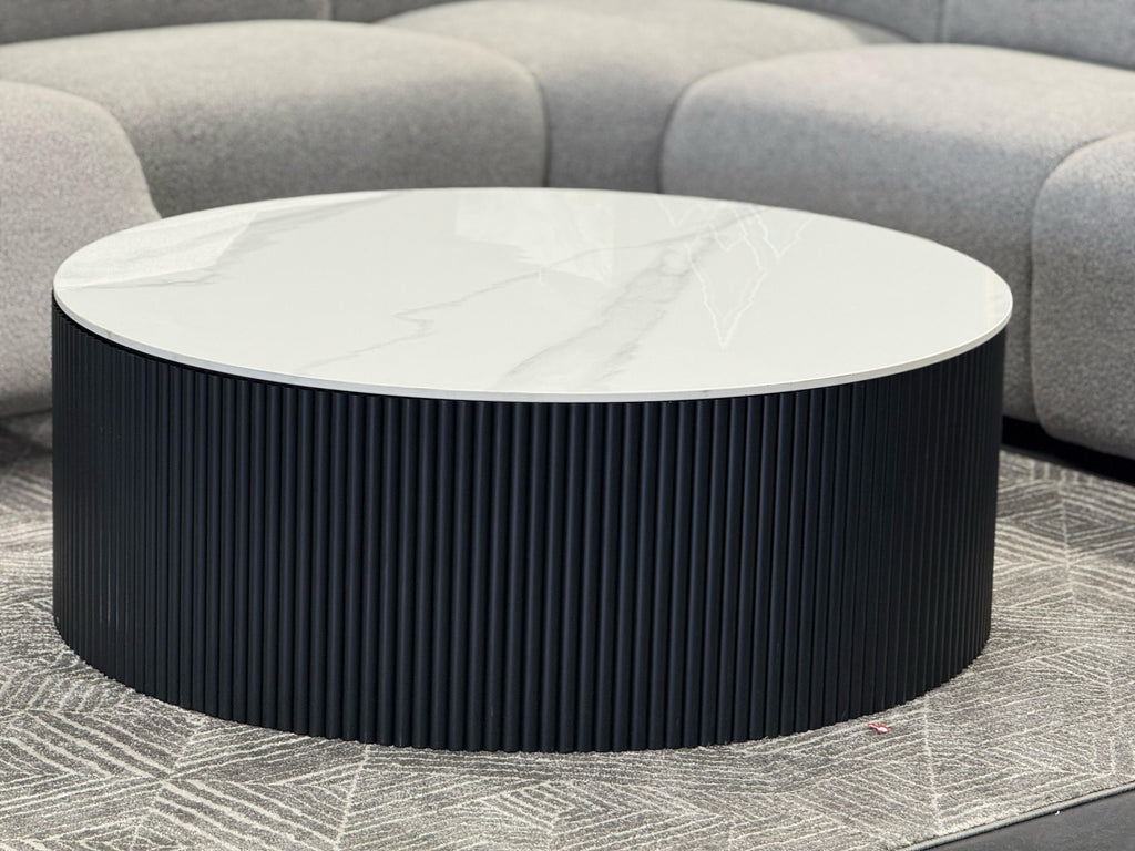 Ripple black coffee table with white marble top styled in grey lounge room