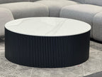 Ripple black coffee table with white marble top styled in grey lounge room