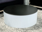 White Ripple coffee table with black top styled in living room décor