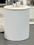 White Ripple round side table with ribbed body styled in living room