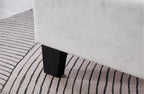 Close-up of Winston Velvet Bed sturdy black legs with premium light grey velvet base