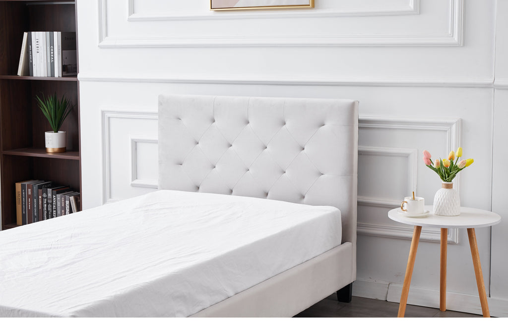 Elegant tufted headboard of Winston Velvet Bed in light grey velvet upholstery.