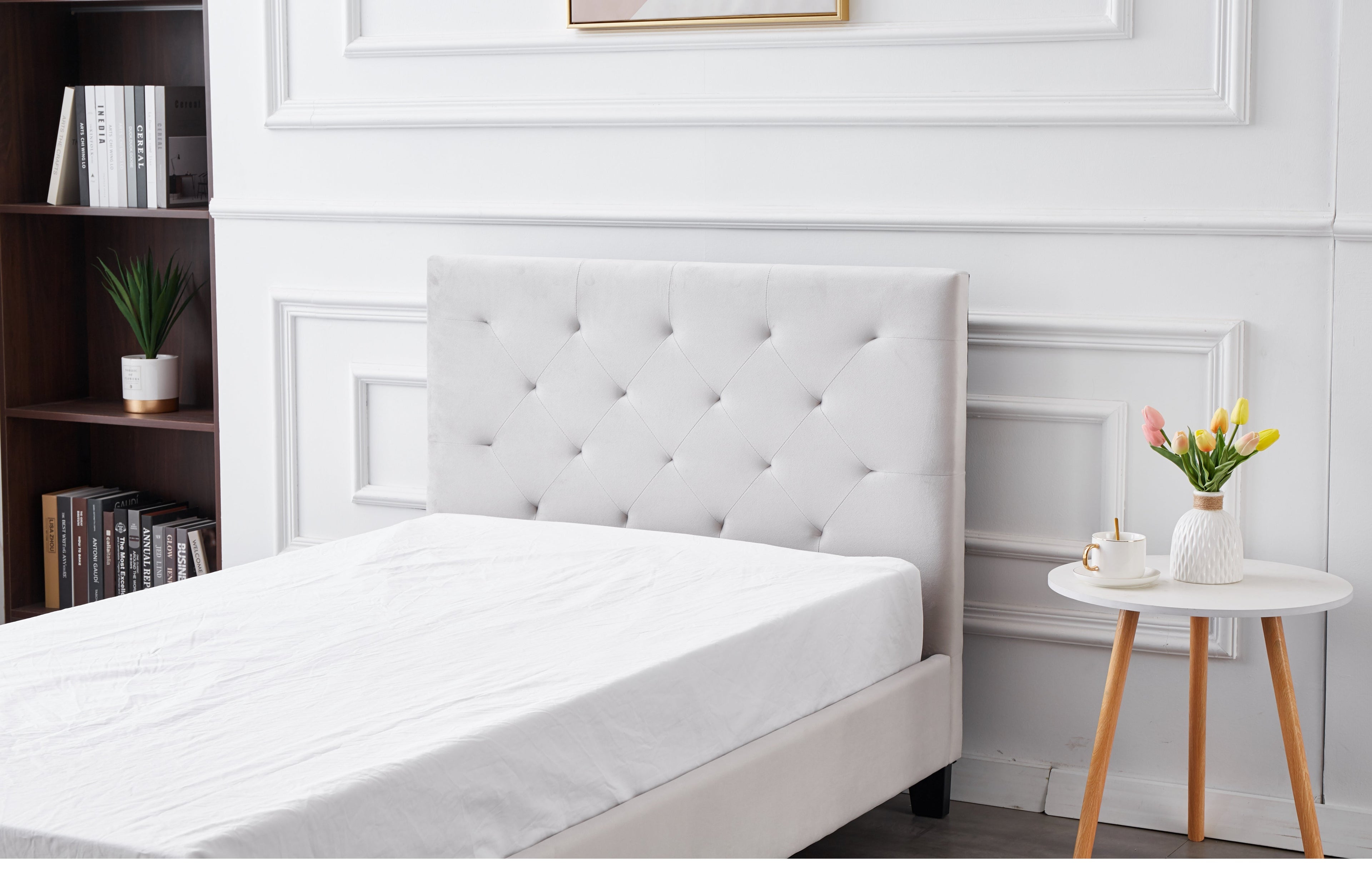 Elegant tufted headboard of Winston Velvet Bed in light grey velvet upholstery.